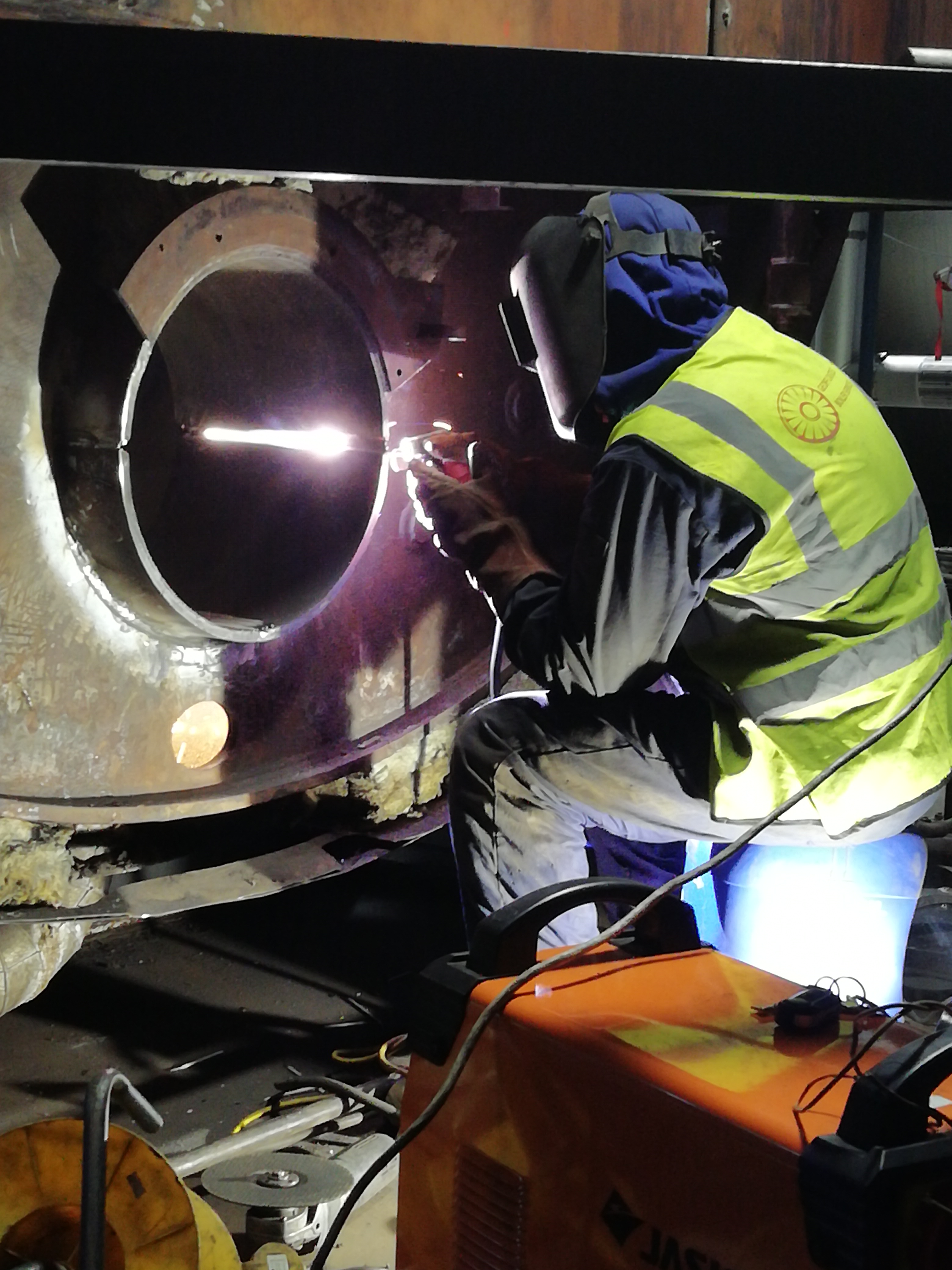D-patch repair on rear access of a steam boiler at William Grants In Girvin, Scotland.